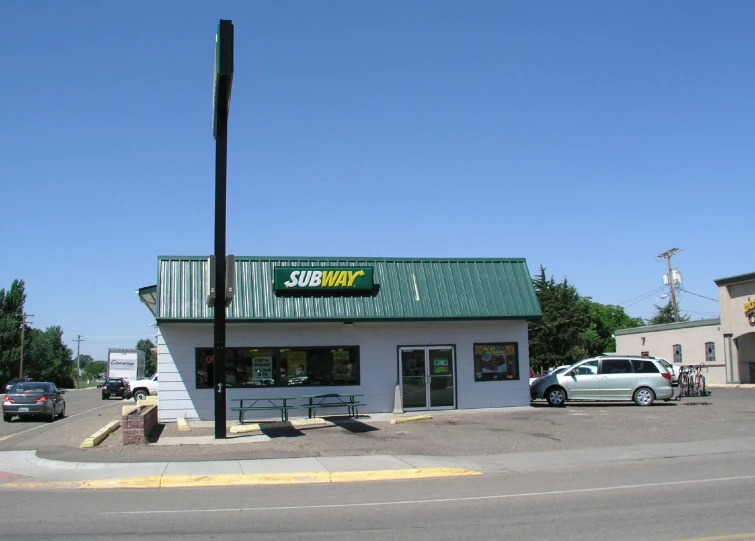 an empty street with a large store front