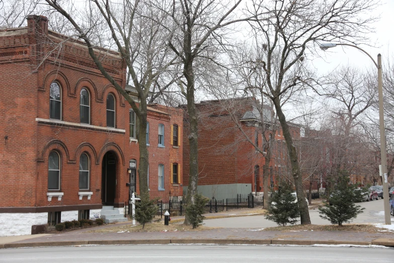 an old brick building with many windows and doors