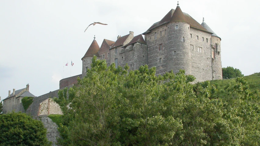 an image of a castle that appears to be on top of a hill