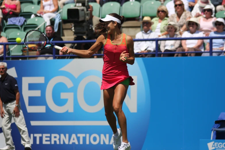 a female tennis player in action on the court