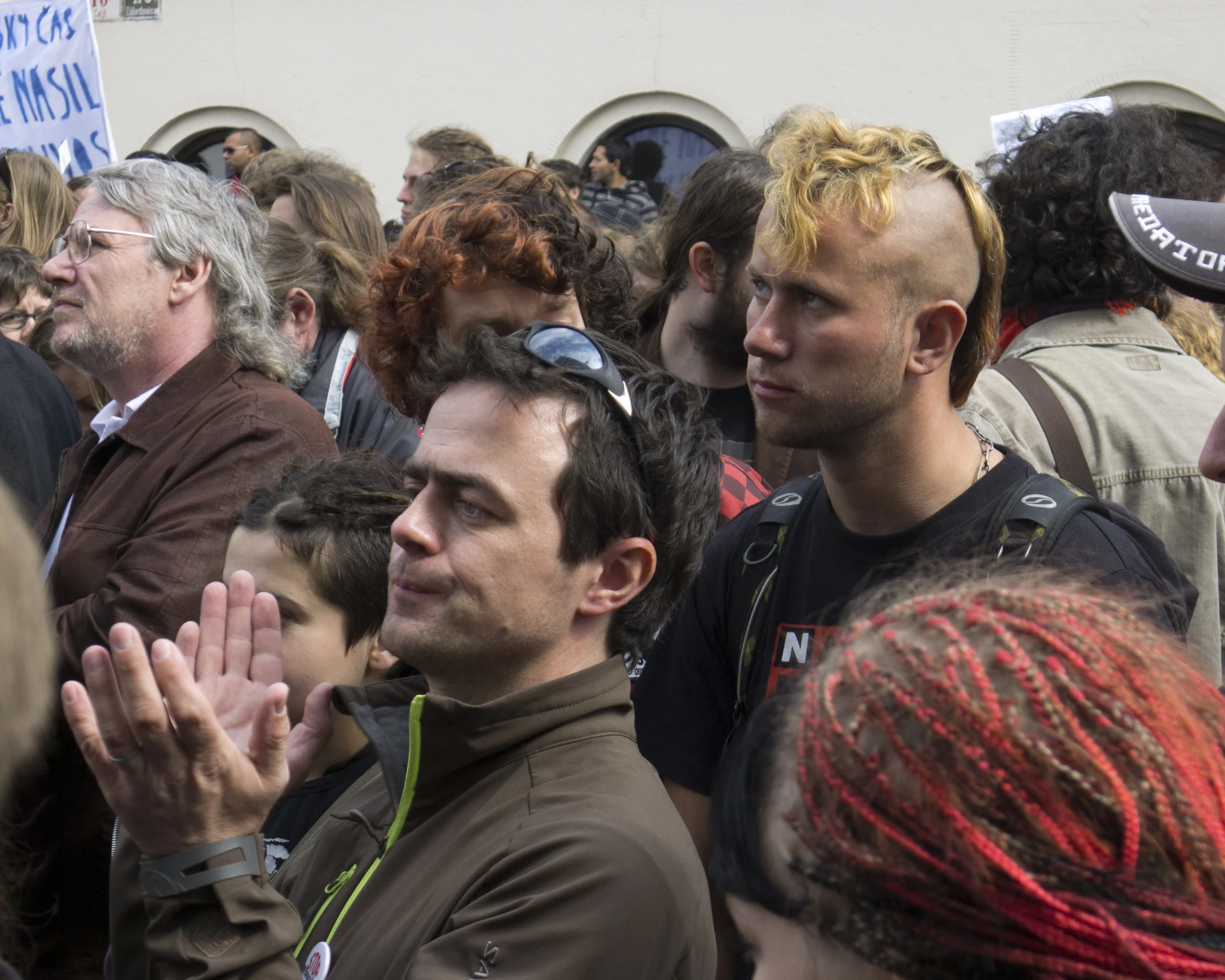 a crowd of people with a person wearing head bands