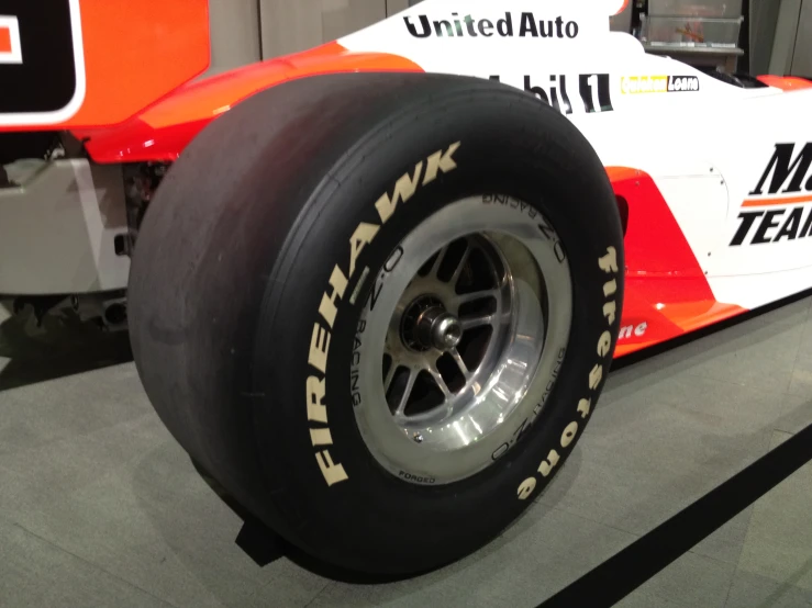 a close up of a race car tire on a track