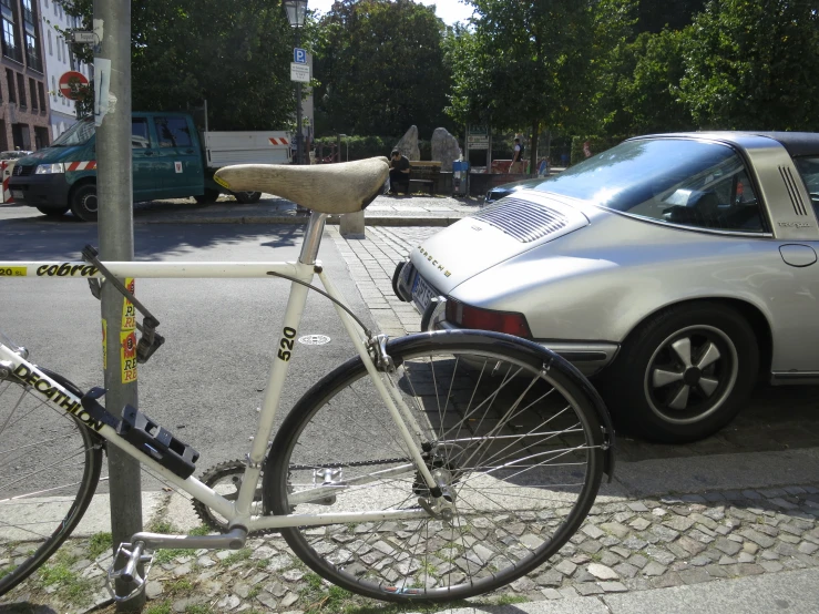 a bicycle parked on the side of the road