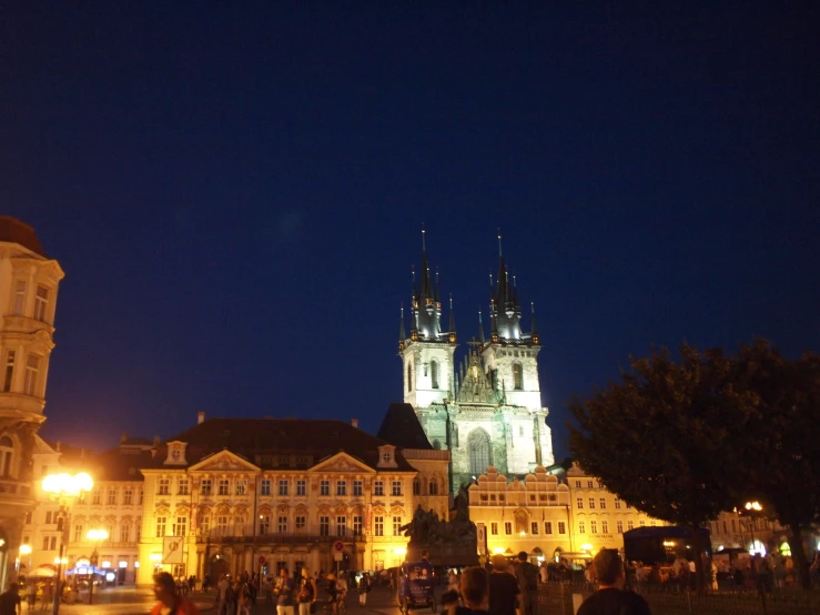 the large clock tower in the old town is lit up