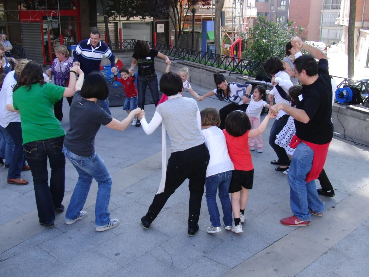 there are many children on the street and someone is taking pictures