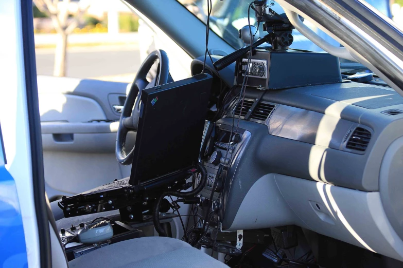 a view inside a car dashboard and interior with a steering wheel