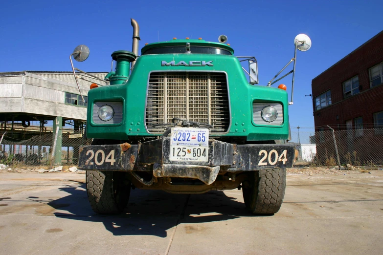 an old truck parked in front of two buildings