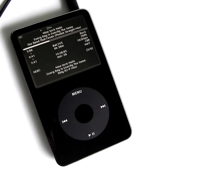 an ipod is lying on its side against a white background