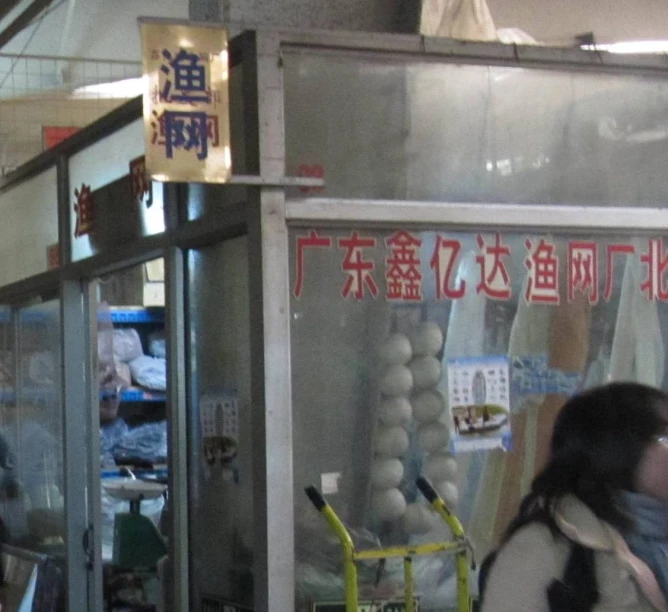 a woman is waiting at the food counter