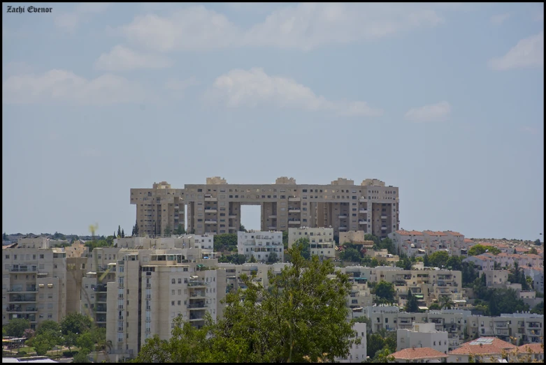 a view of buildings with a bird flying over it