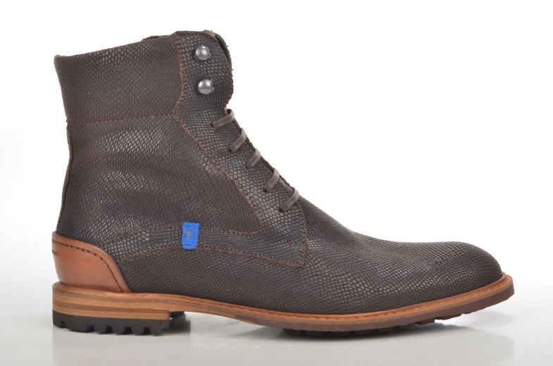 a grey boot with a brown sole and blue detail