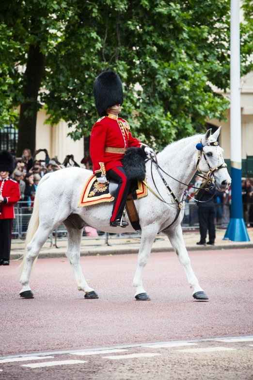 a horse mounted soldier and a uniformed man