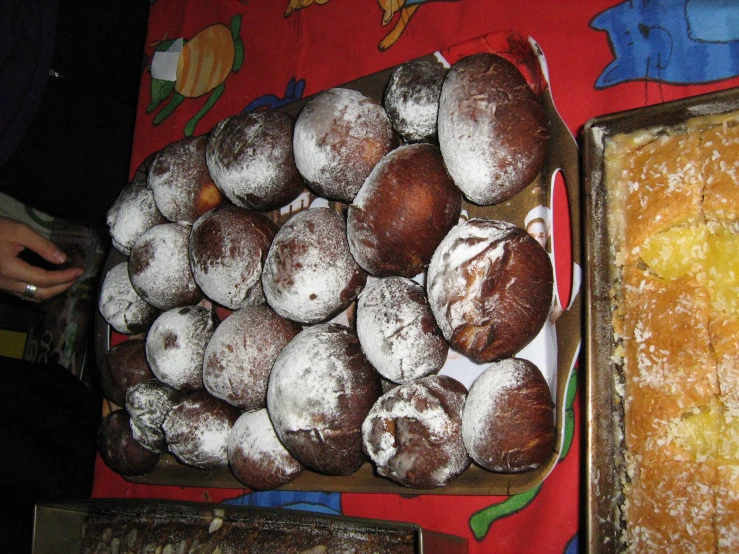 a large number of donuts on top of plates