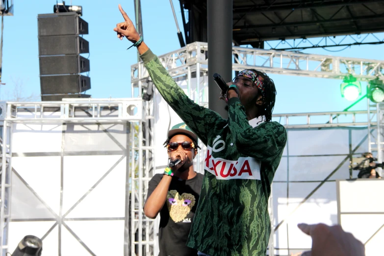 a group of men standing next to each other on stage