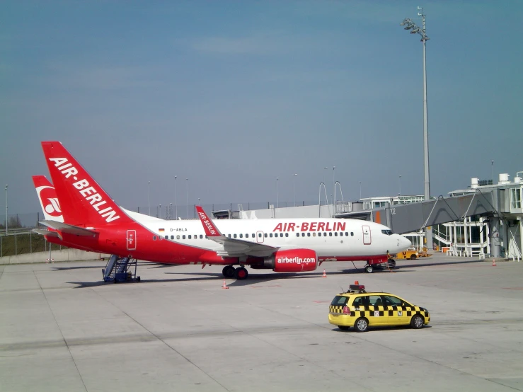 a large jetliner sitting on top of an airport tarmac