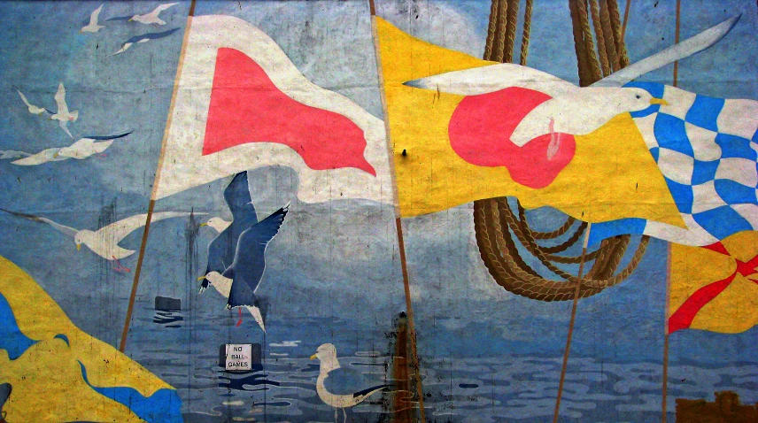 several banners with birds are on the wall