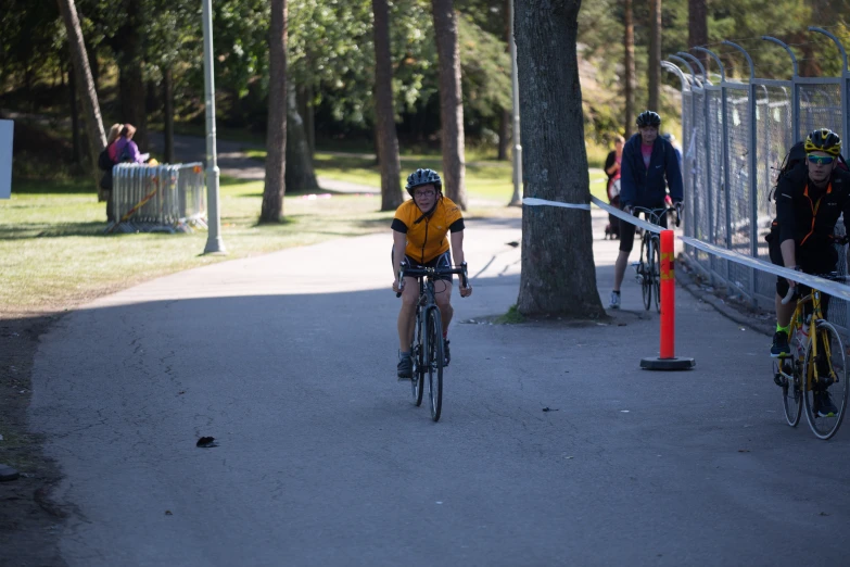 cyclist racing down a street, at the finish line