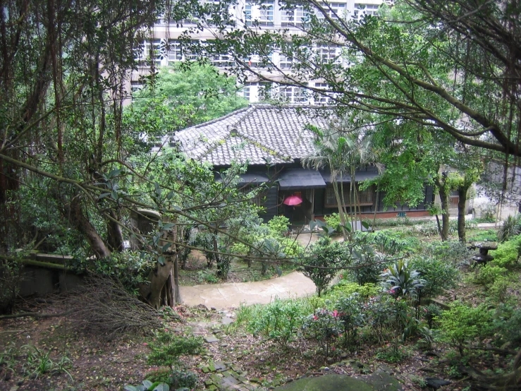 there is an oriental building with many trees