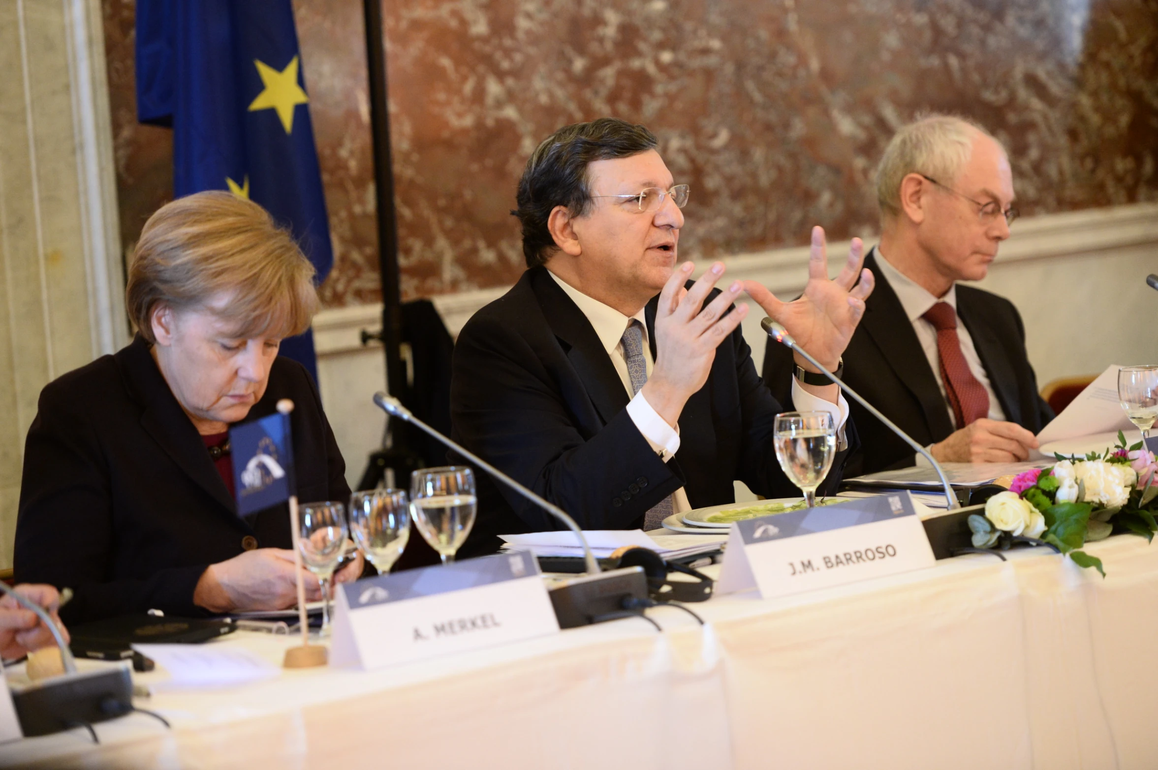 men in suits at a meeting and women in business wear