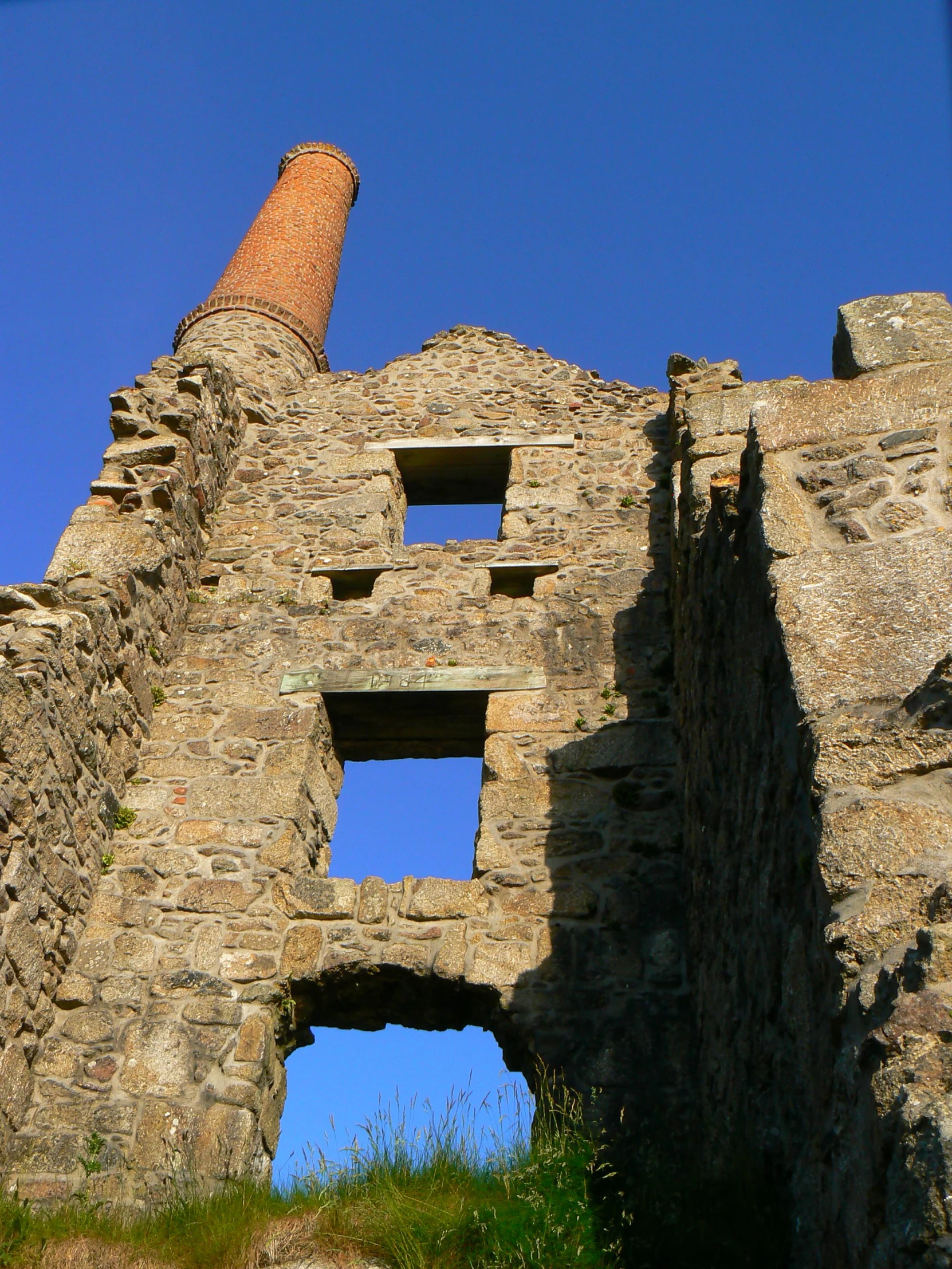 an image of a brick building with a very tall tower