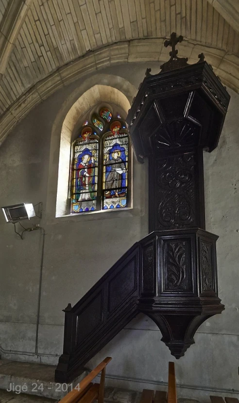 a stair case in an old church with stained glass windows