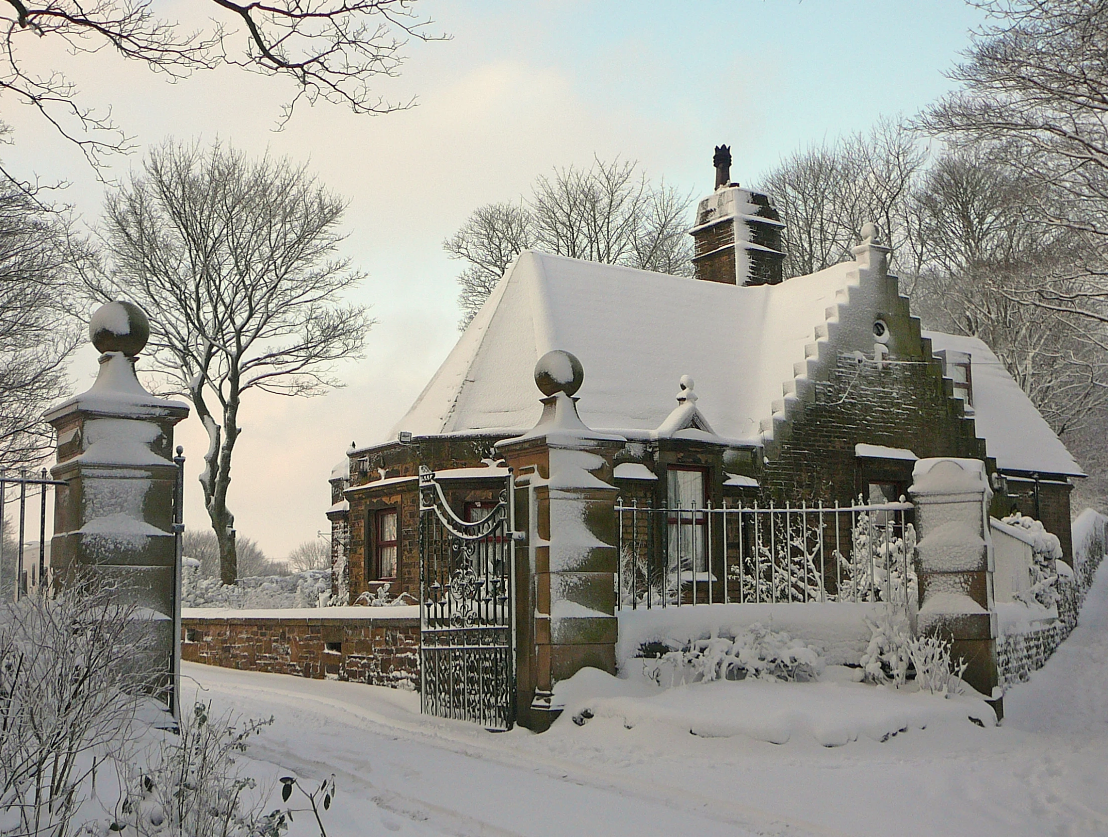 a beautiful home that has snow on the roof