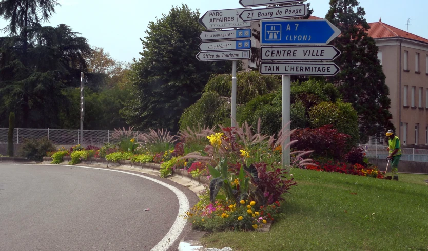 a road sign showing the way to different places