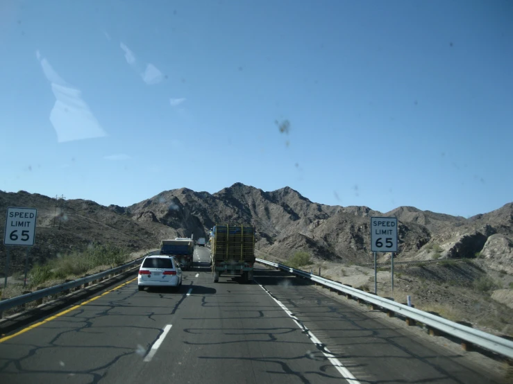 the back end of a car waiting to cross into an interstate