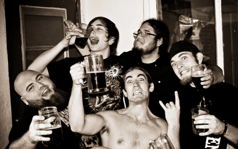 some friends drinking beers together in black and white