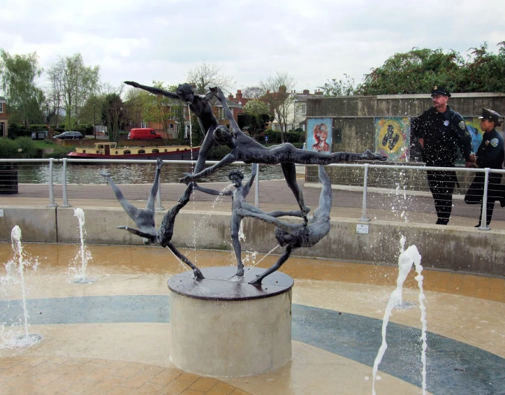 there is a sculpture in a square on top of the ground