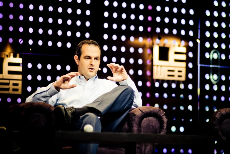 a man sitting on top of a chair