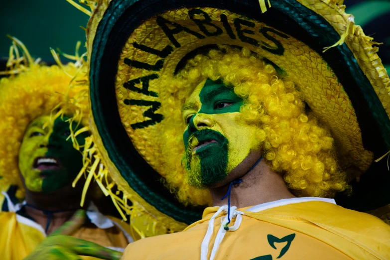 a close up of a person wearing yellow