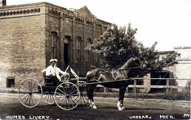 an old picture of a man riding a horse and buggy