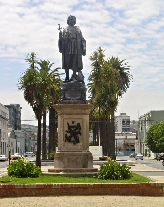 a statue of a man with a gun on top of it