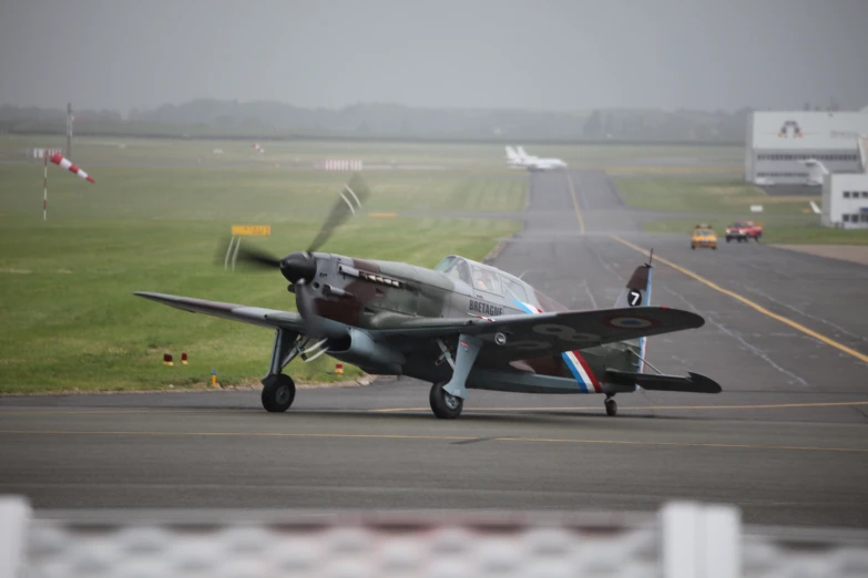 a small aircraft is taking off from a runway