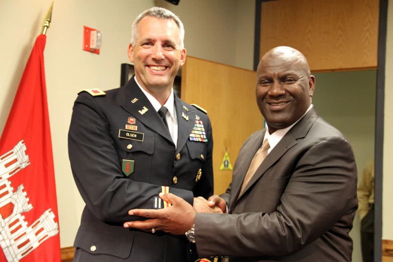 two men in uniforms posing for a picture