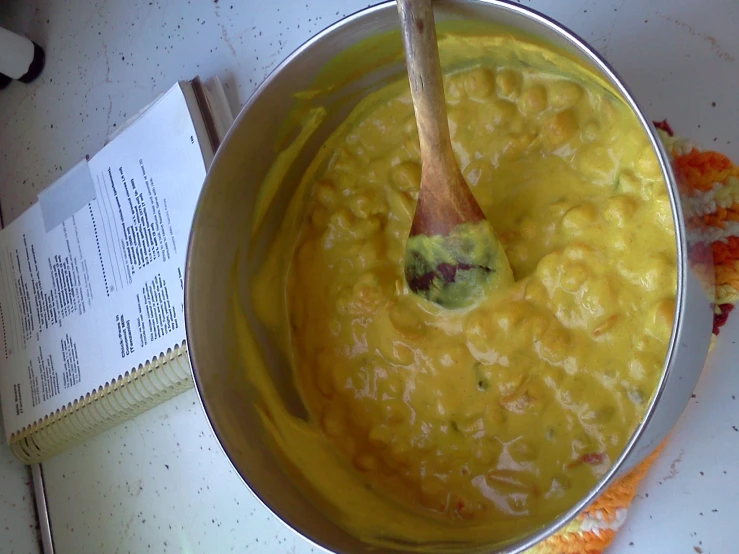 the spoon is being used to stir the food