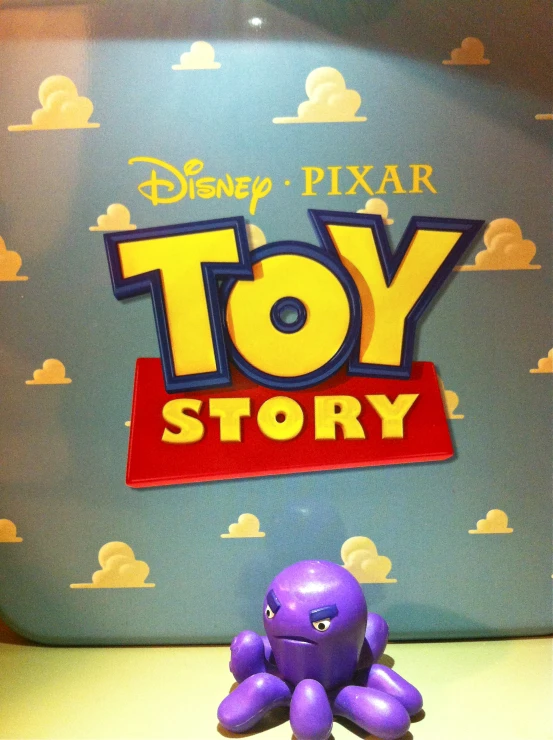 toy story logo with an elephant on a white shelf