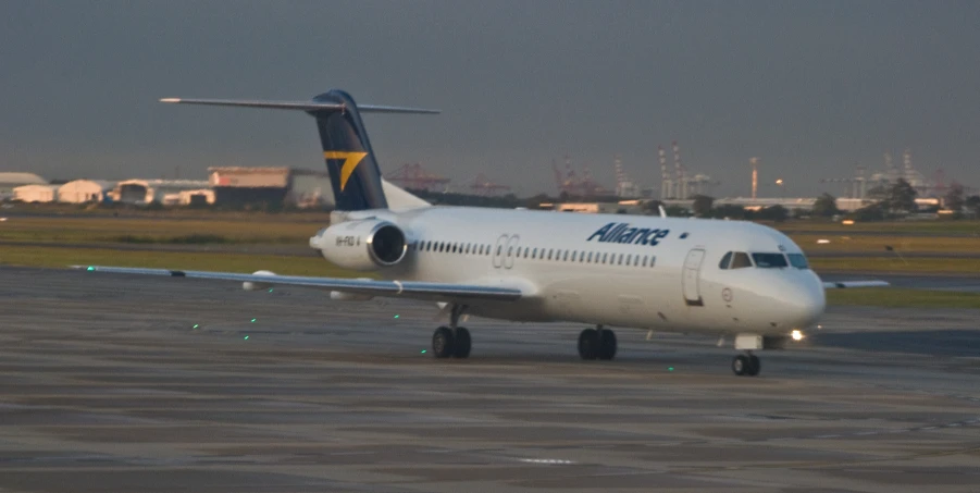 a jet is parked on the runway at an airport