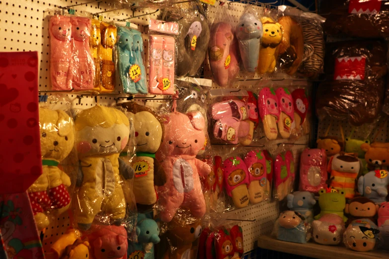 many cute teddy bears are hanging on a wall