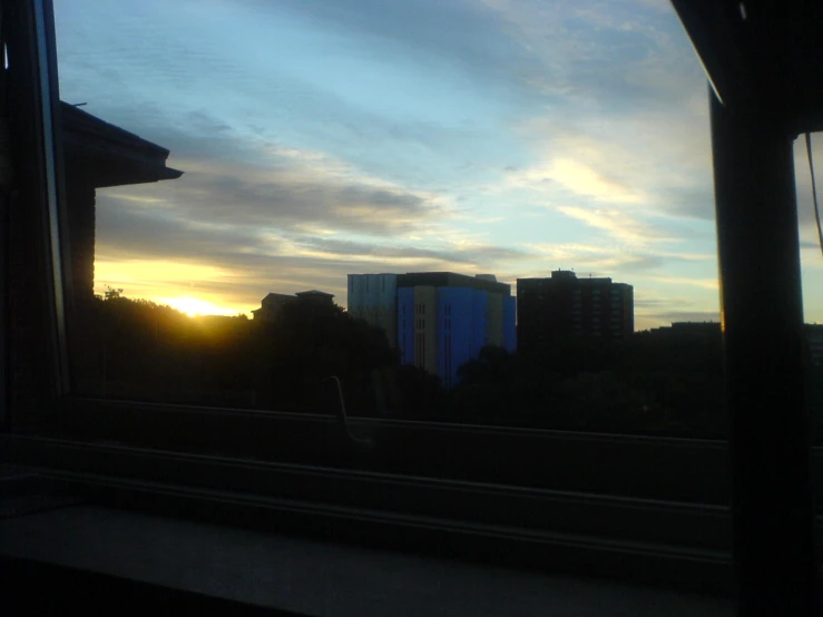 sunset seen through window from train going into station