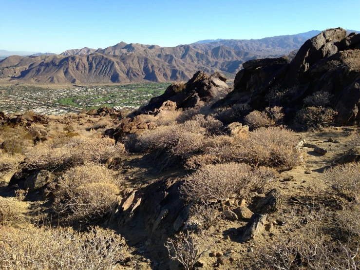 a view of a hilly area with rocky formations