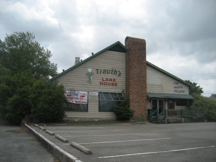 a large tan building with a red roof