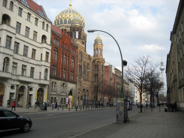 some tall buildings with a gold dome on top of it