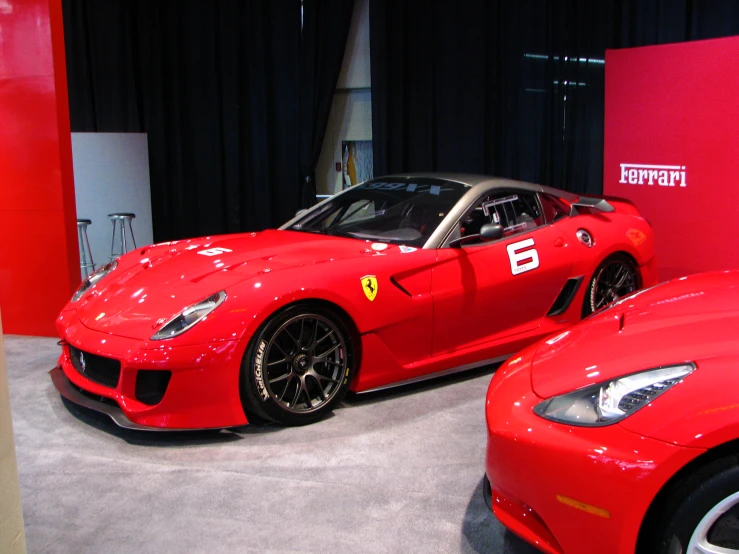 ferrari cars displayed in a showroom during the day