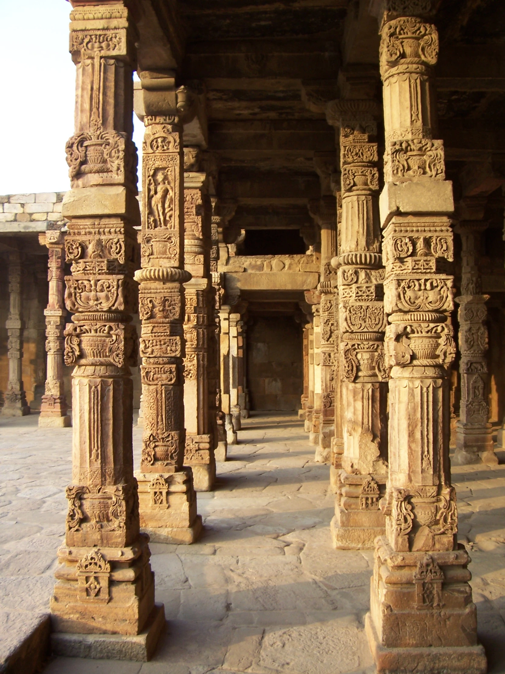 intricate pillars in a courtyard at an ancient indian temple