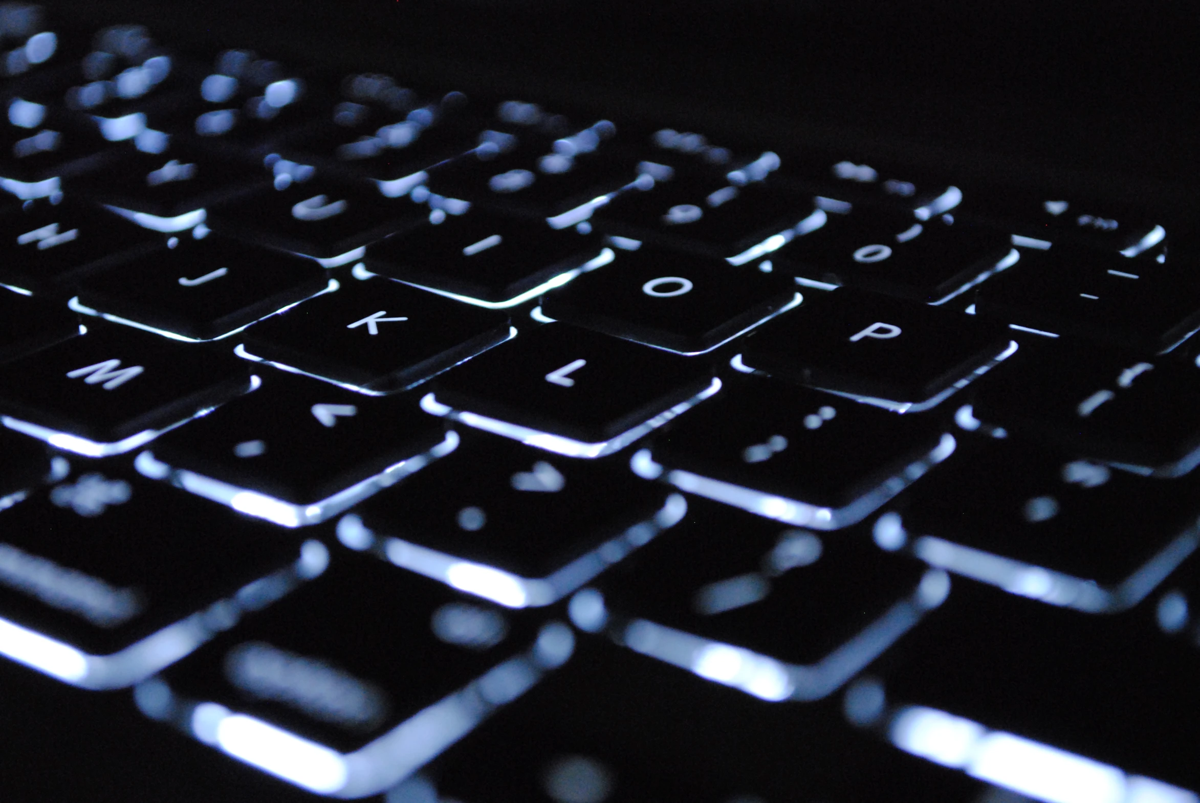 a close up s of a keyboard with key board lit on