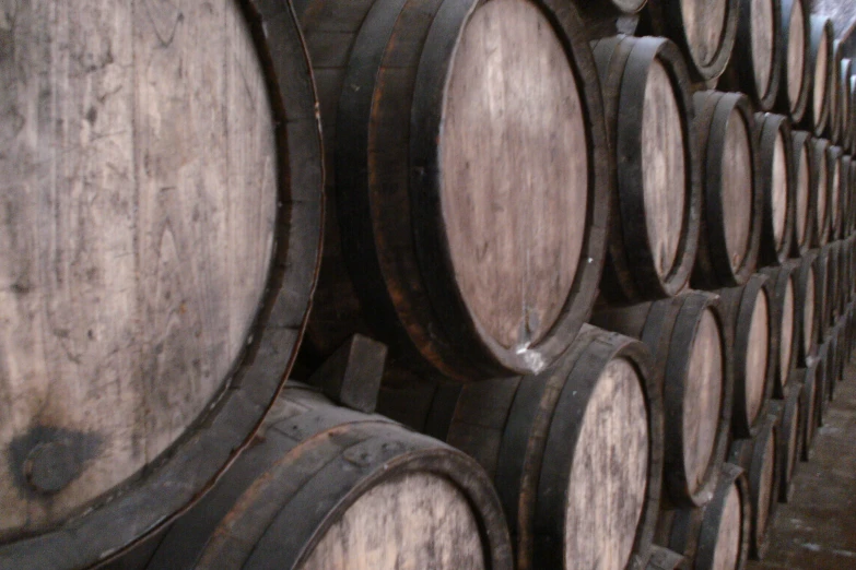 an array of wine barrels sitting next to each other