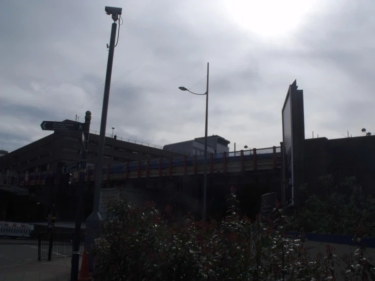 an overpass with street lamps next to it