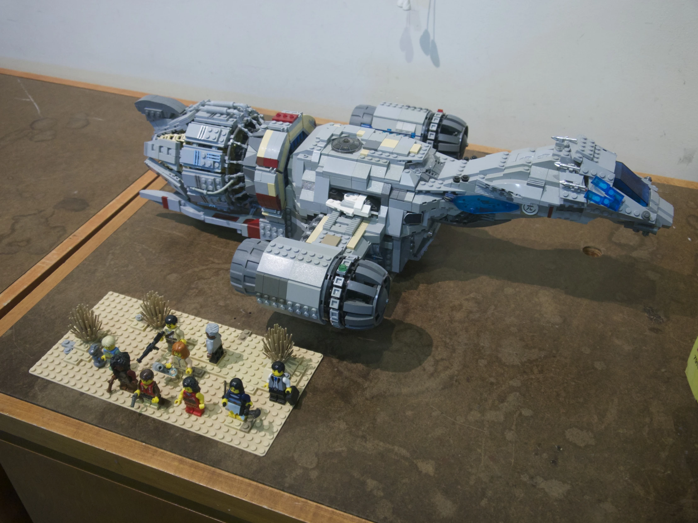 a lego battleship with people on it on a table